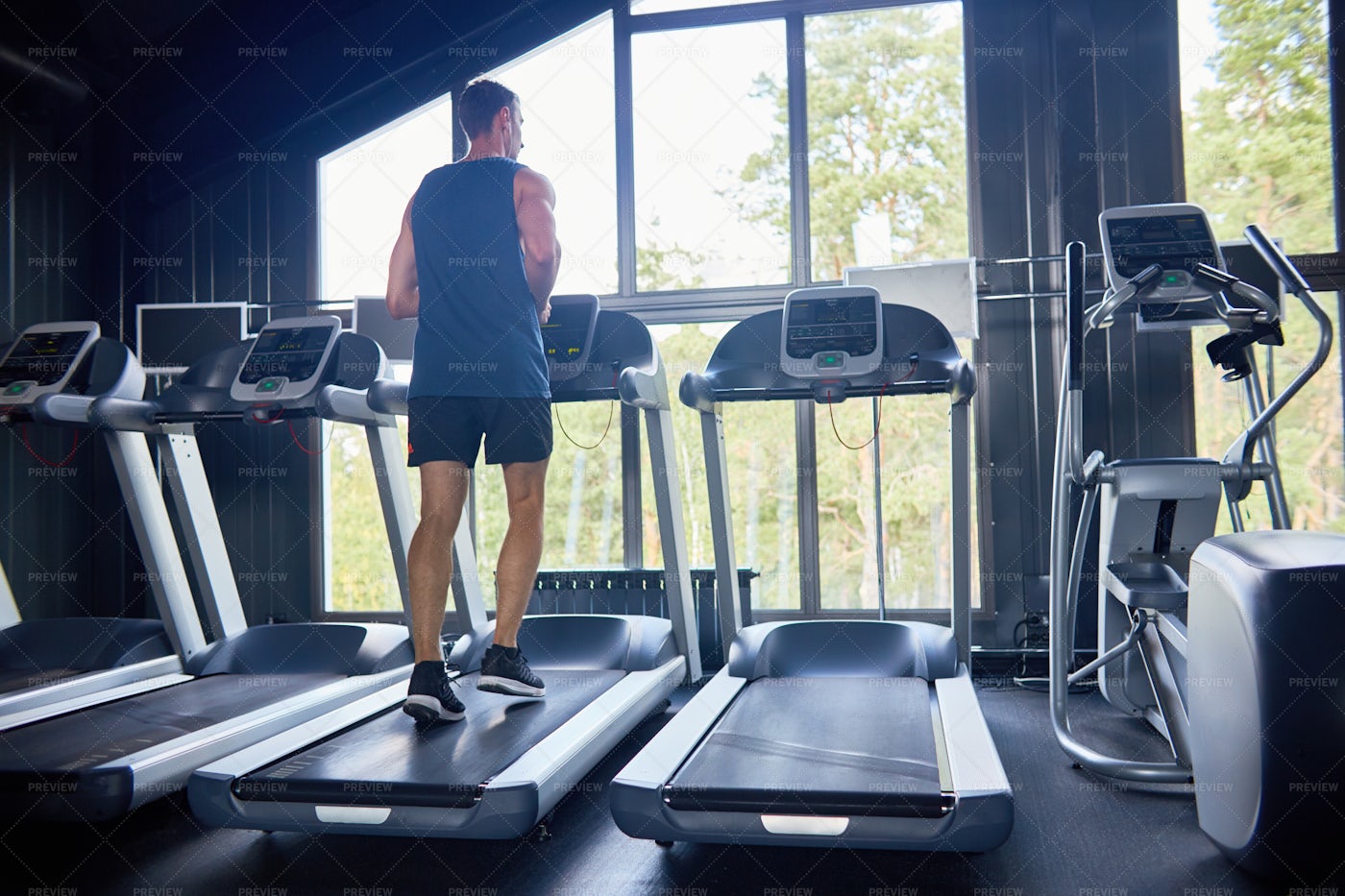 Running On Treadmill At Gym: Stock Photos