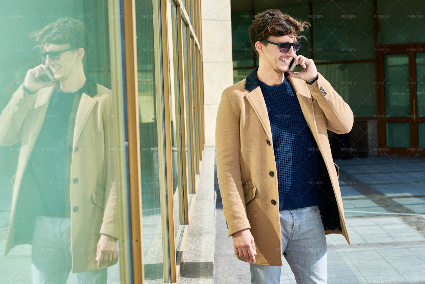 Young Man Speaking By Phone...: Stock Photos