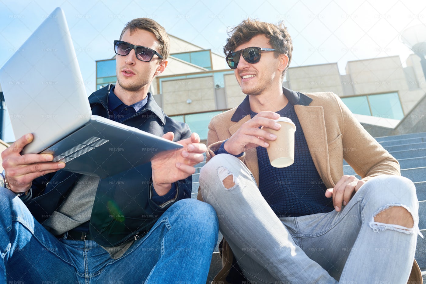 Modern Young Men Using Laptop In...: Stock Photos