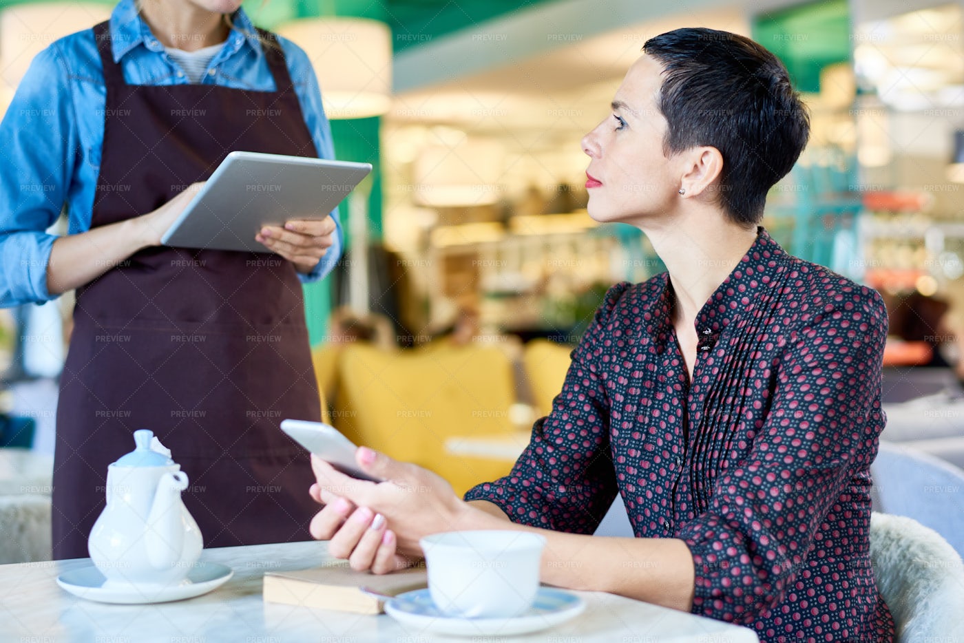 Elegant Woman Ordering Food In Cafe: Stock Photos