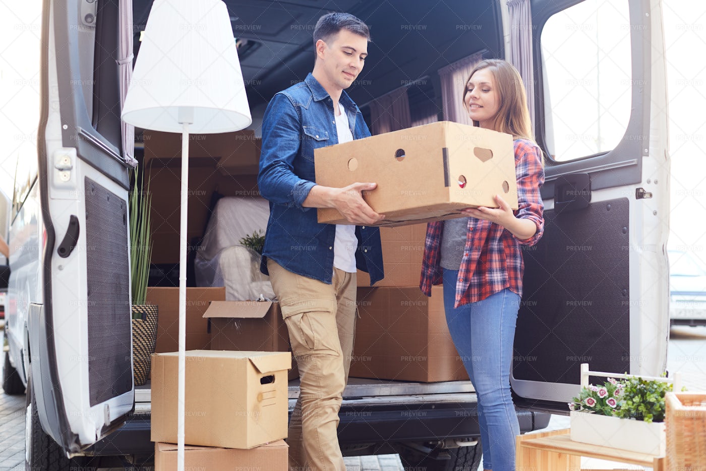 Young Couple Unloading Van: Stock Photos