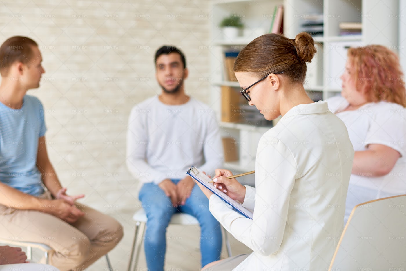Young Female Psychologist Leading...: Stock Photos