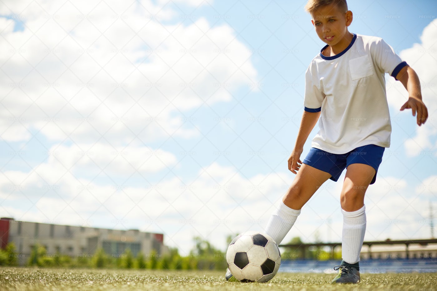 Teenage Boy Playing Football: Stock Photos