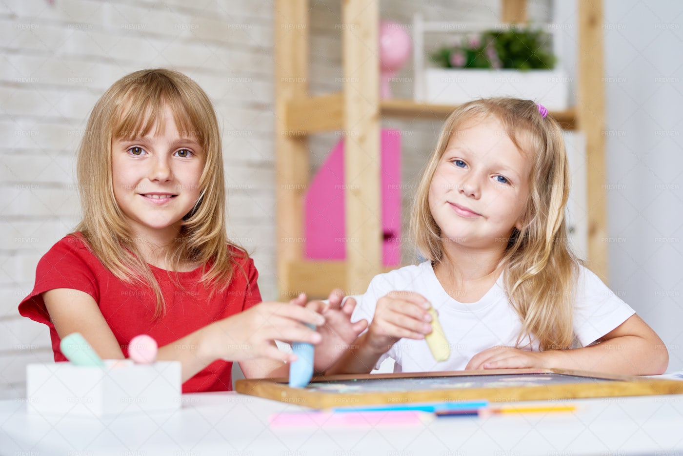 Cute Sisters Playing With...: Stock Photos