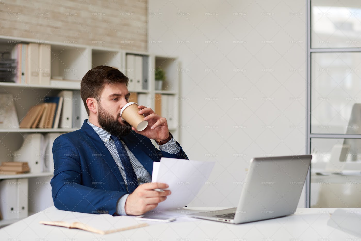 Modern Businessman Drinking Coffee...: Stock Photos