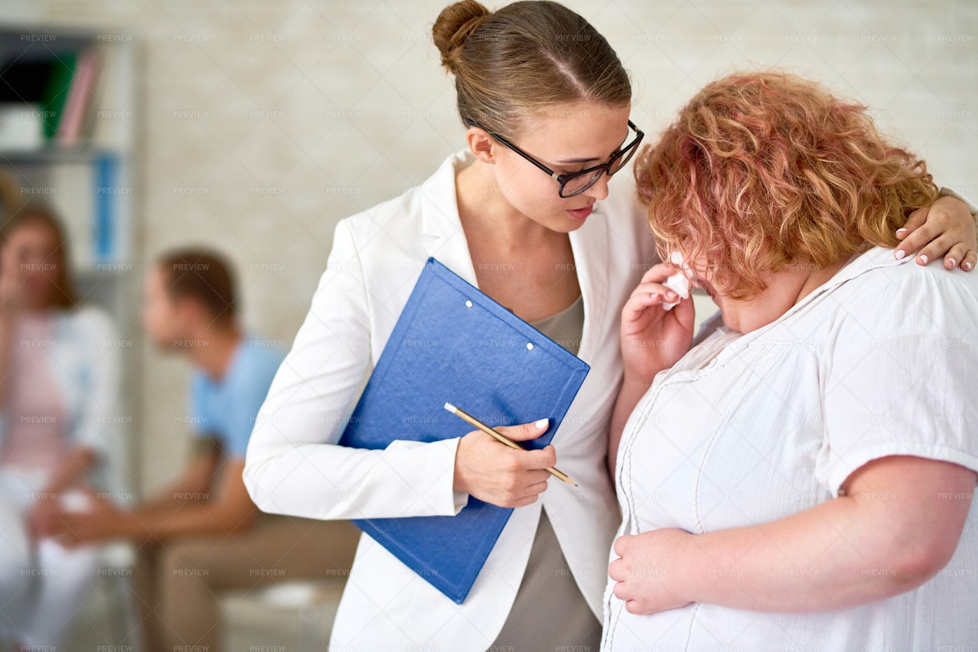 Psychiatrist Comforting Crying...: Stock Photos