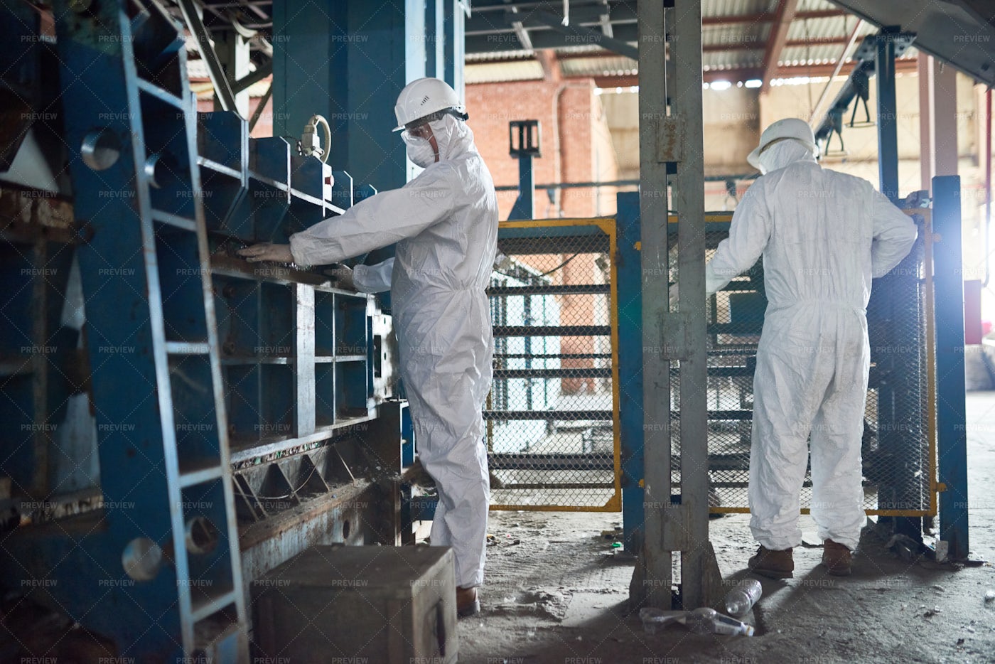Workers In Hazmat Suits At Modern...: Stock Photos