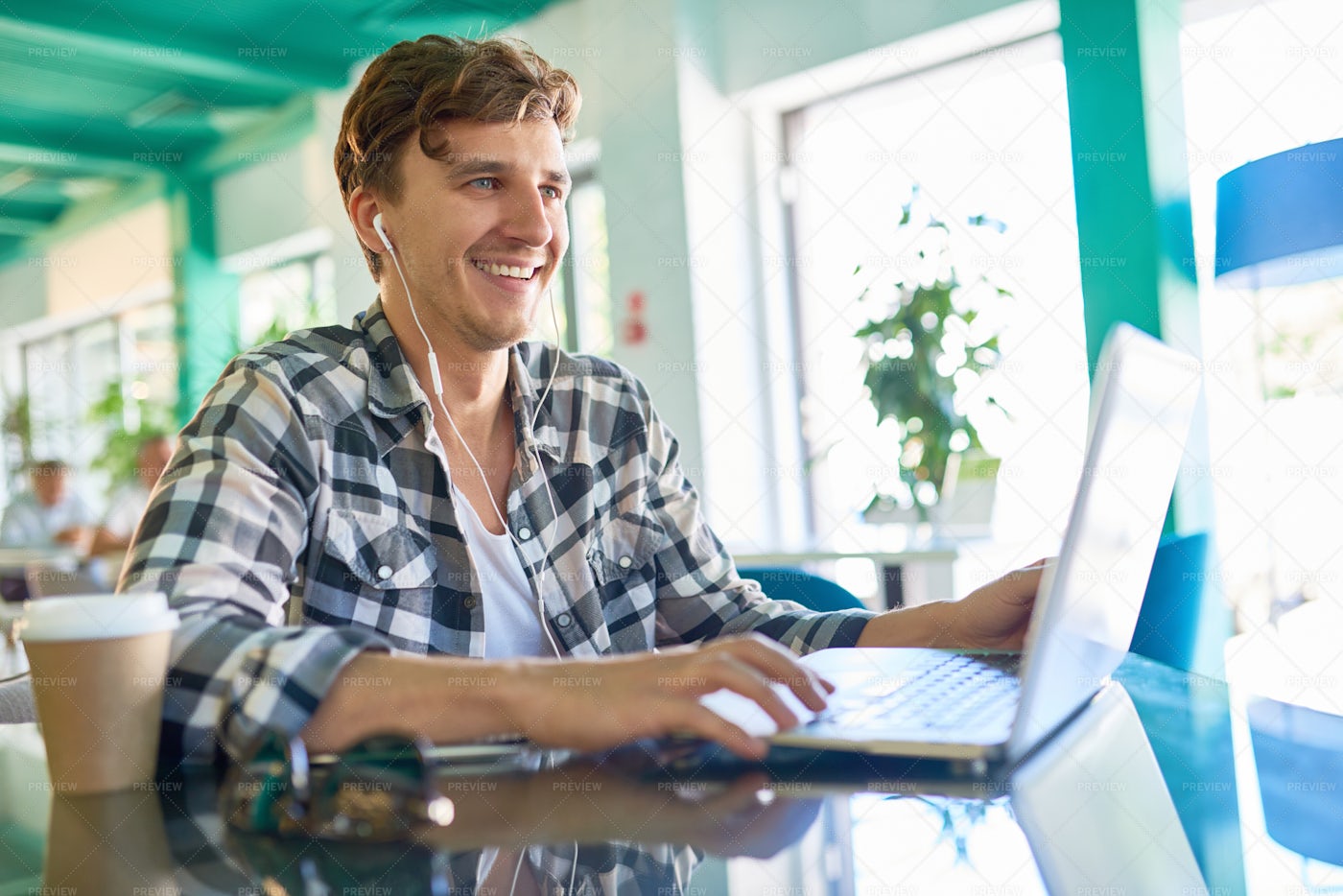 Happy Young Man Working With Laptop...: Stock Photos