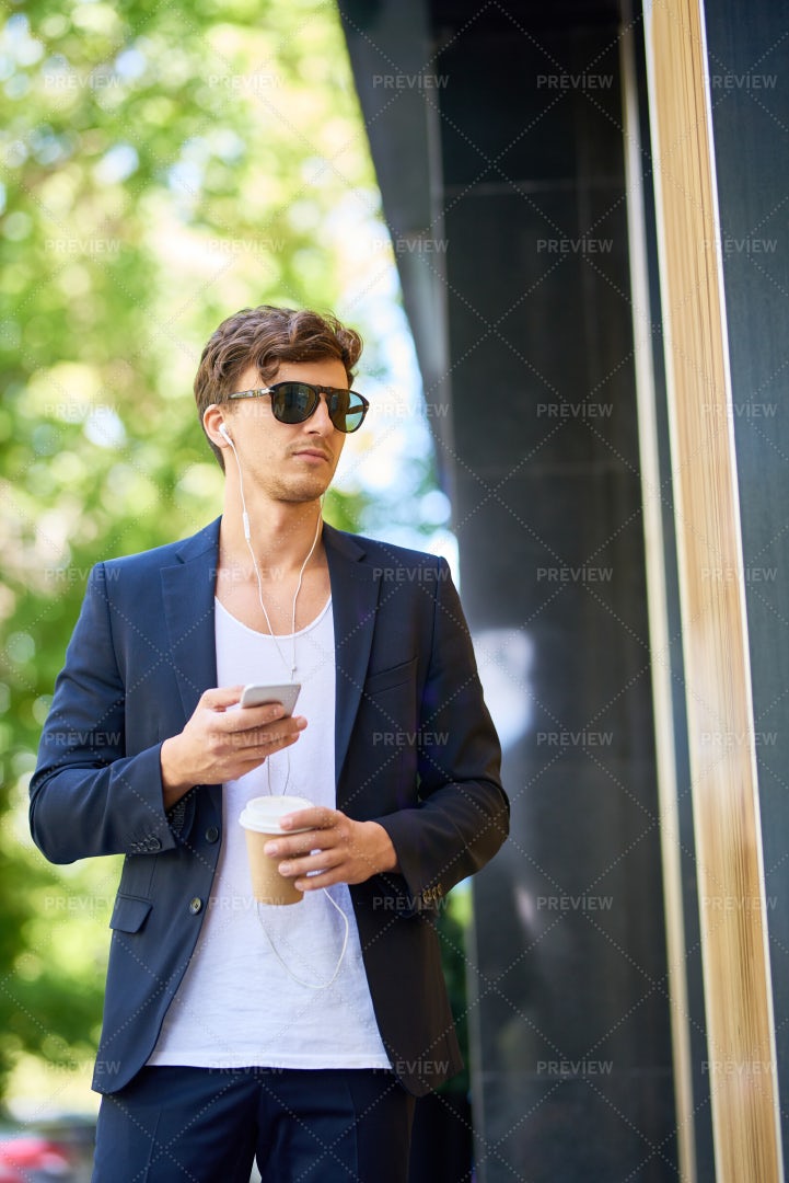 Handsome Young Man Walking In City: Stock Photos