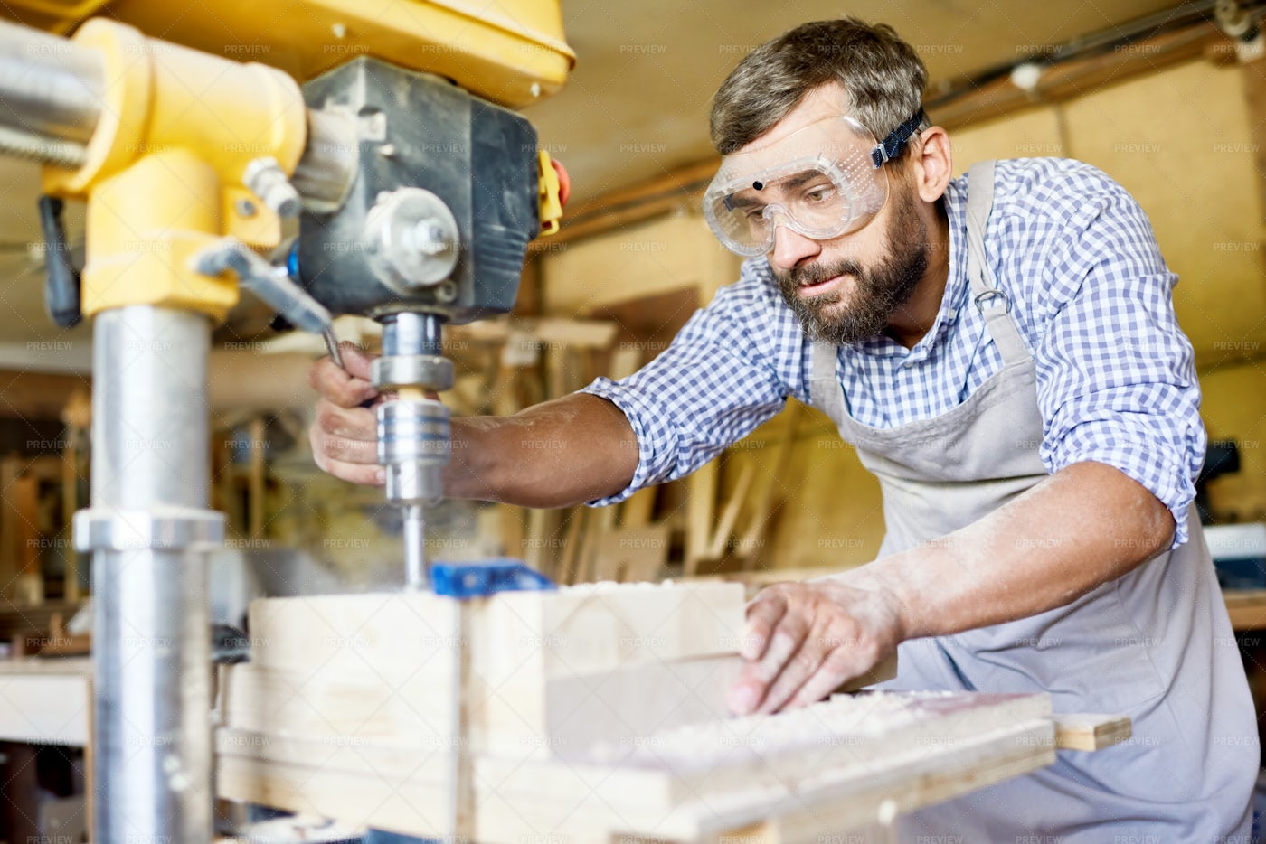 Bearded Carpenter Wrapped Up In...: Stock Photos