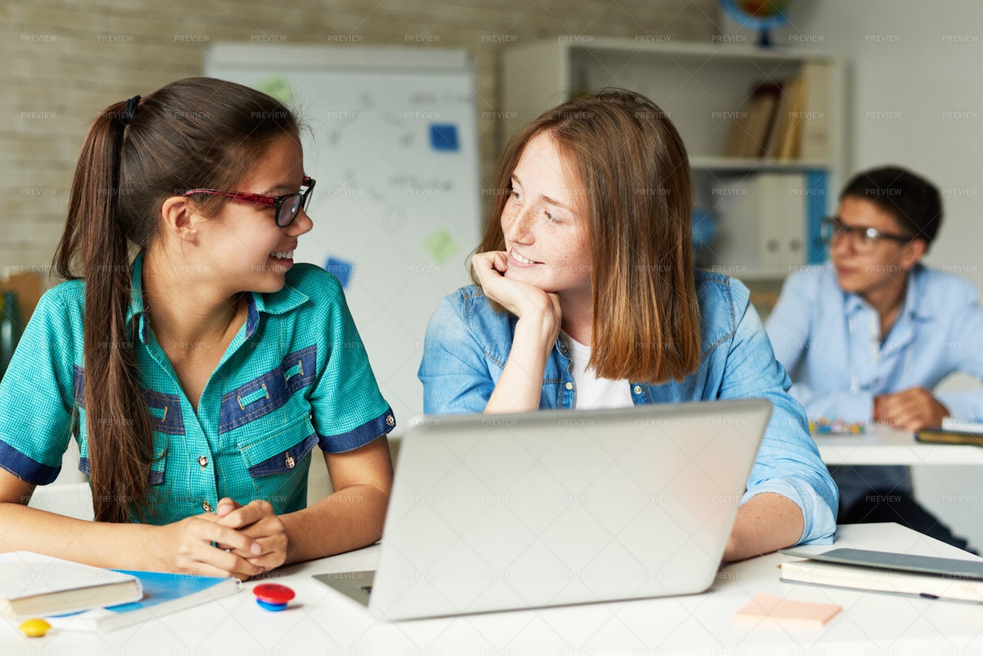 Two Girlfriends Chatting During...: Stock Photos