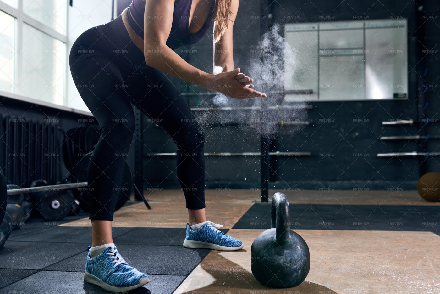 Strong Woman Lifting Kettlebells In...: Stock Photos