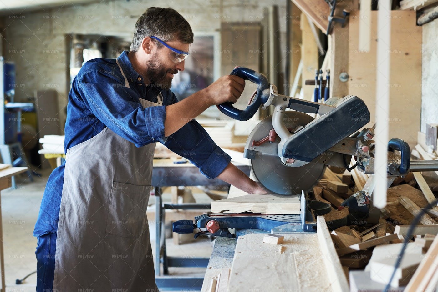 Carpenter Using Electric Cutting...: Stock Photos
