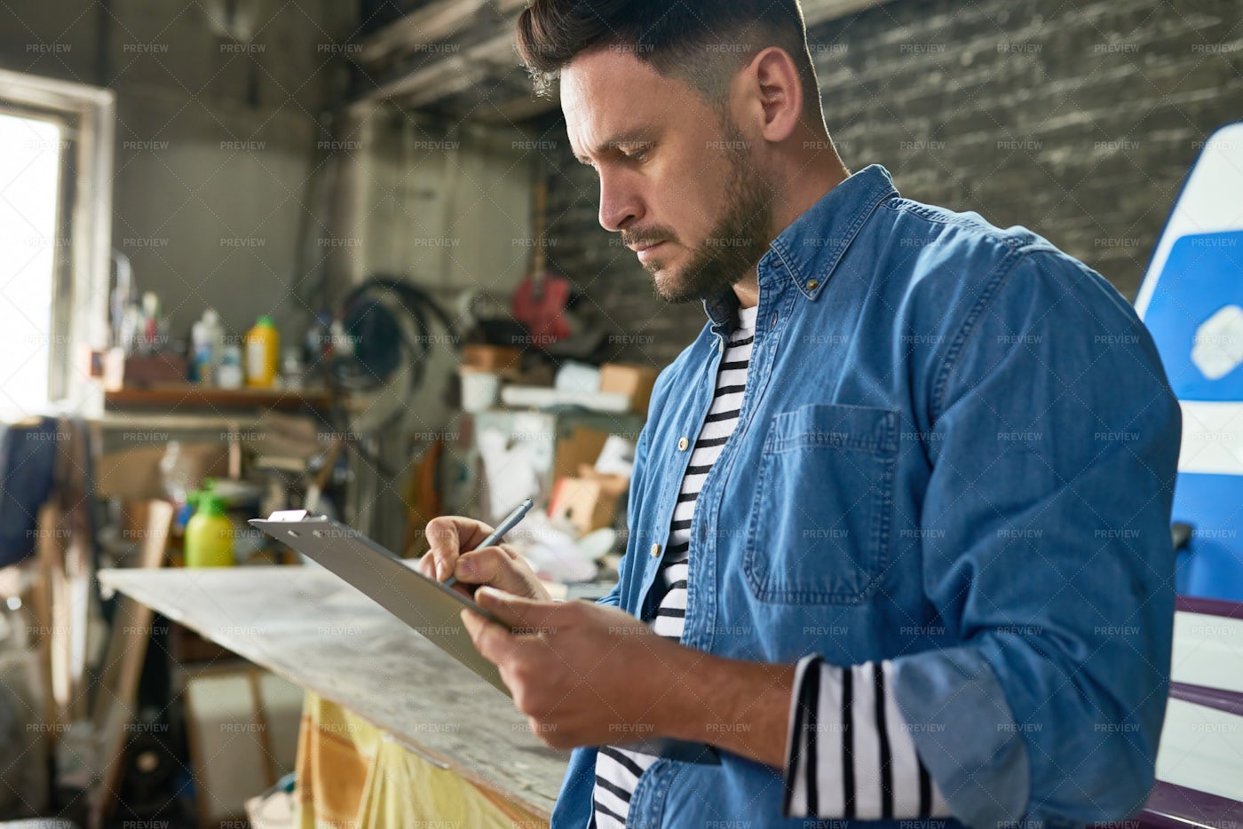 Man Planning Project In Workshop: Stock Photos