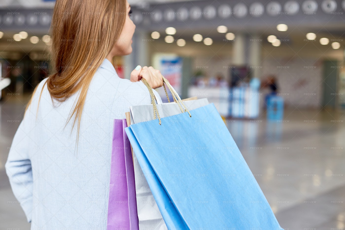 Young Woman Holding Shopping Bags...: Stock Photos