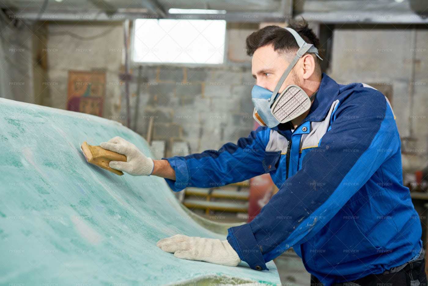 Man Working In Boat Repairs: Stock Photos