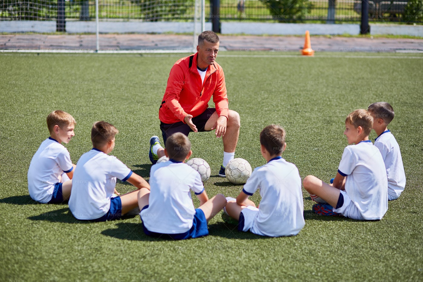 Coach Instructing Junior Football... Stock Photos Motion Array