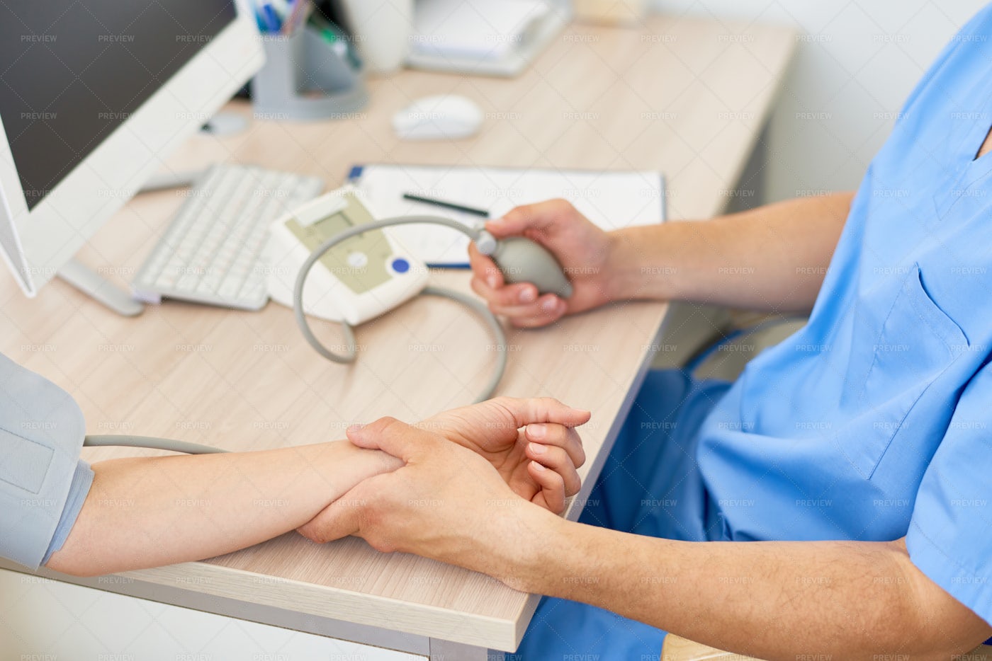 Doctor Measuring Blood Pressure: Stock Photos