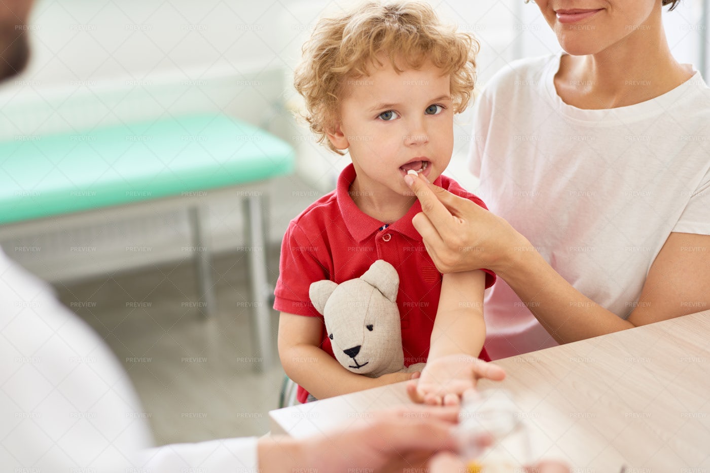 Little Boy Taking Pills: Stock Photos