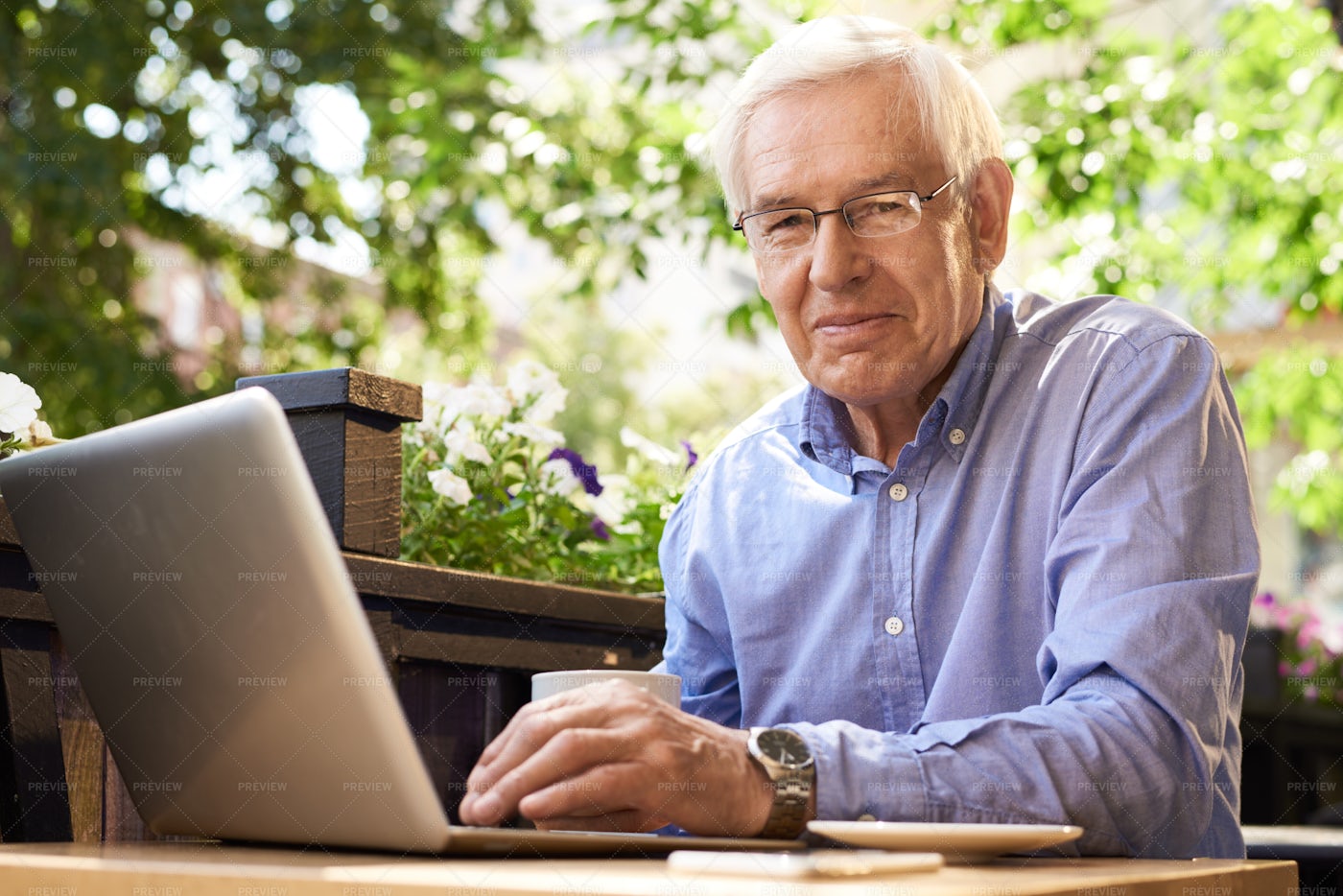 Modern Senior Man Using Laptop In...: Stock Photos