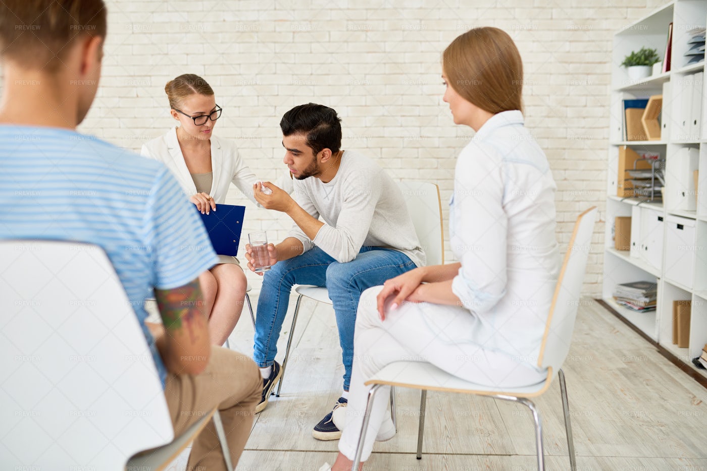 Young Man In Group Therapy Session: Stock Photos