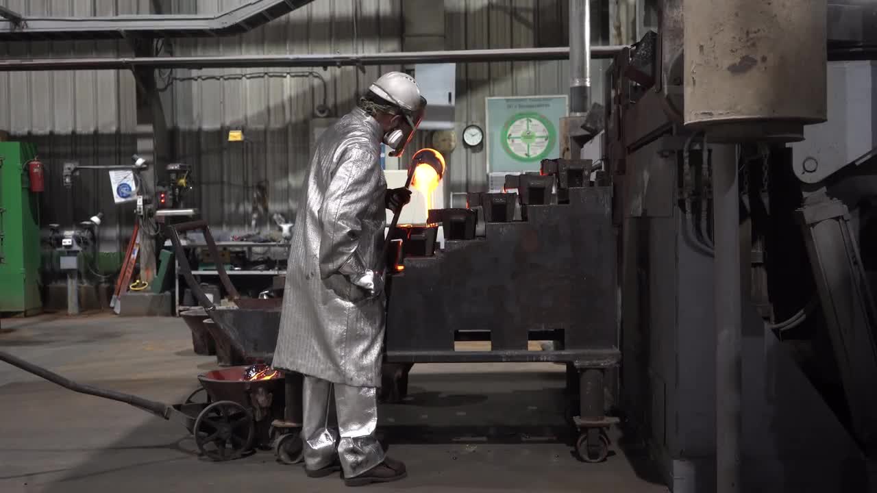 Pouring Melted Gold Into Molds Stock Video Motion Array