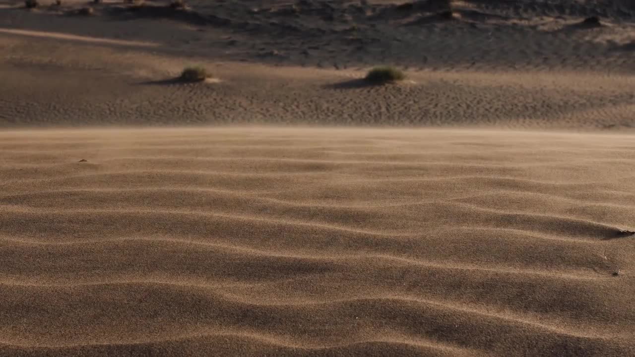 Sand Blows Down Desert Hill - Stock Video | Motion Array