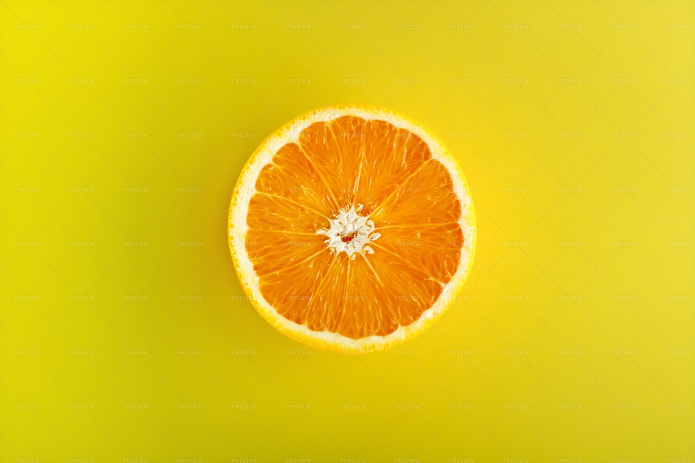 Orange Half On Yellow: Stock Photos
