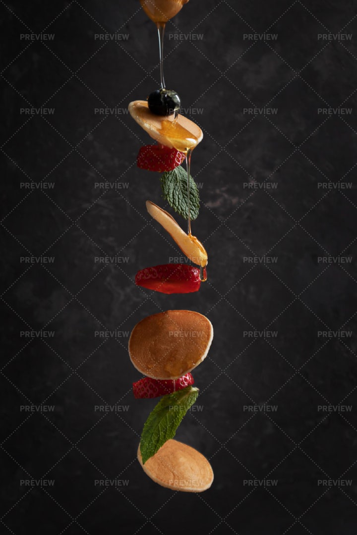 Tiny Pancakes With Berries In Flight: Stock Photos