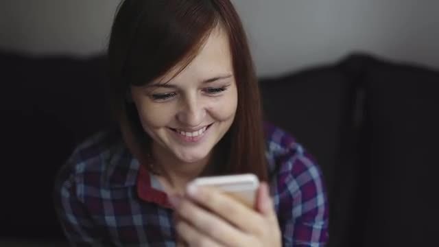 Woman Watching Video On Smartphone: Stock Video