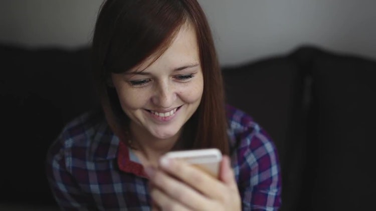 Woman Watching Video On Smartphone: Stock Video