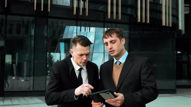 Professionals Discussing Business Outdoors: Stock Video