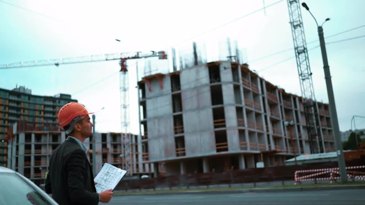 Architect Arrives At Construction Site: Stock Video