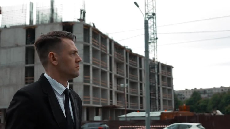 Businessman Looking At Building Project: Stock Video