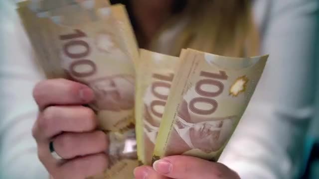 Dissatisfied Woman Counting Canadian Money : Stock Video
