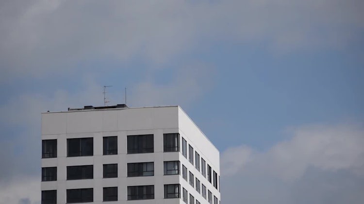 Clouds Flying Around Building: Stock Video