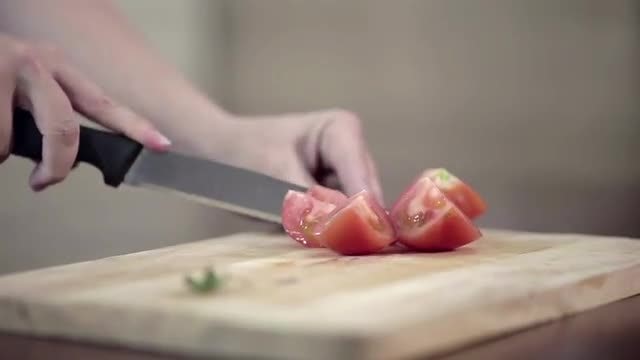 Cook Chopping Tomato On Cutting Board: Stock Video