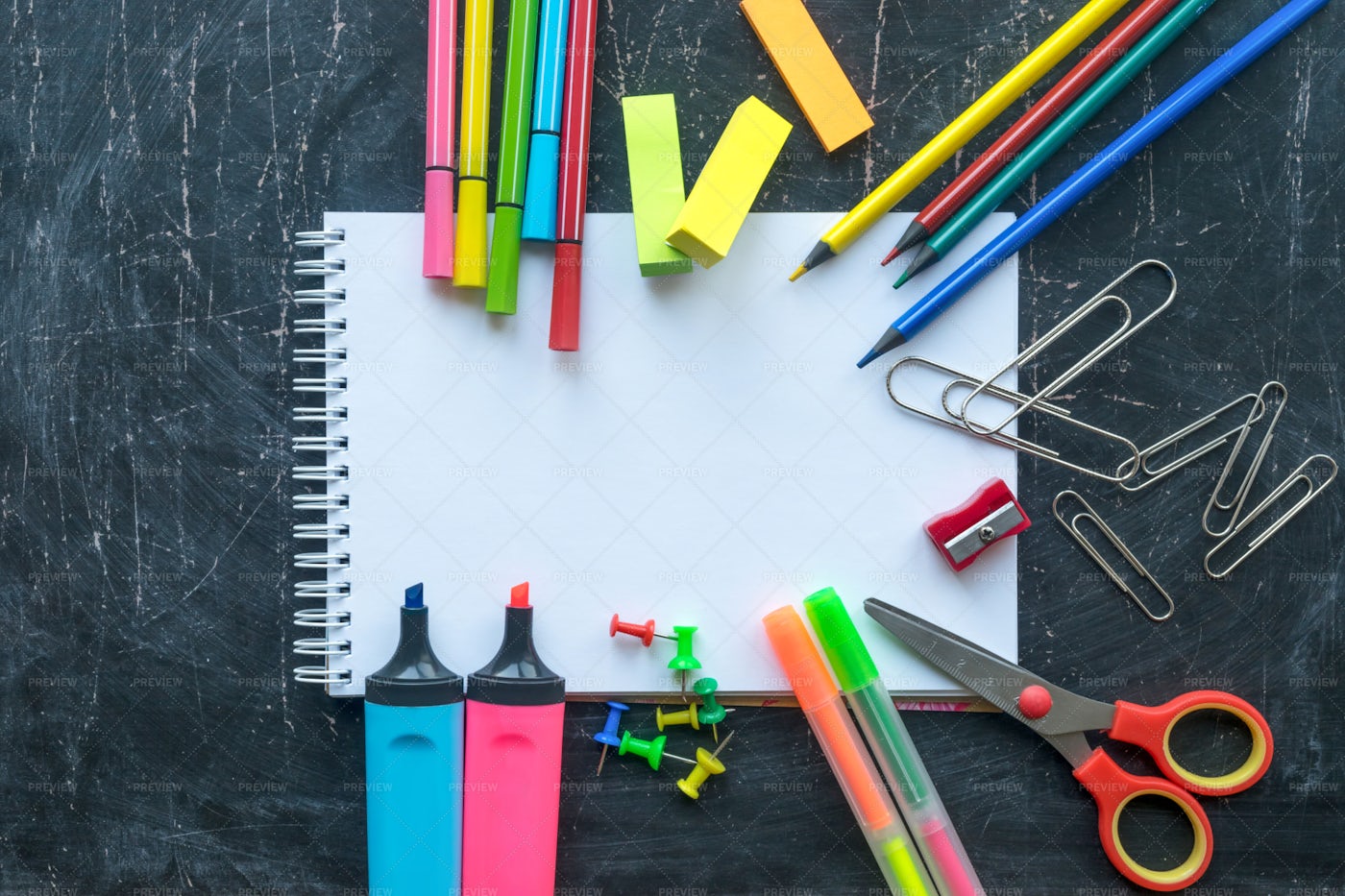 School Supplies On A Chalkboard: Stock Photos
