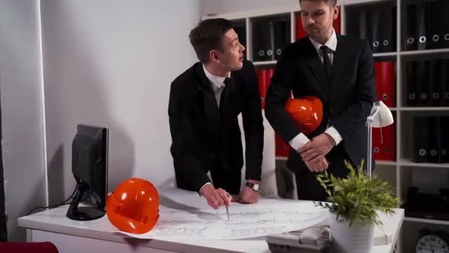 Engineer Architect Discuss Plan: Stock Video