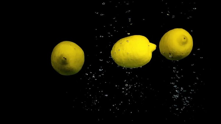 Lemons Dropped Into Water: Stock Video