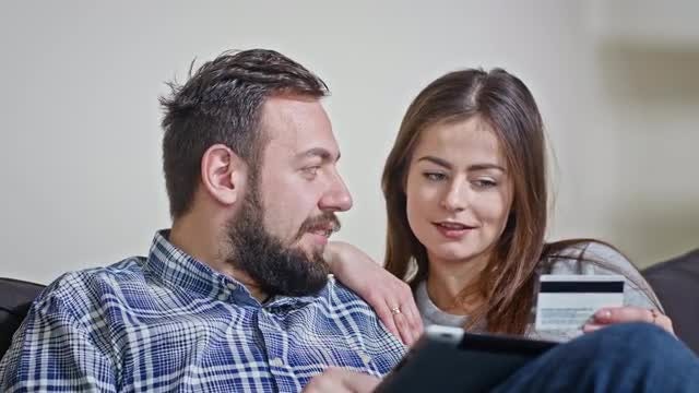 Couple Pays Online Using Tablet: Stock Video