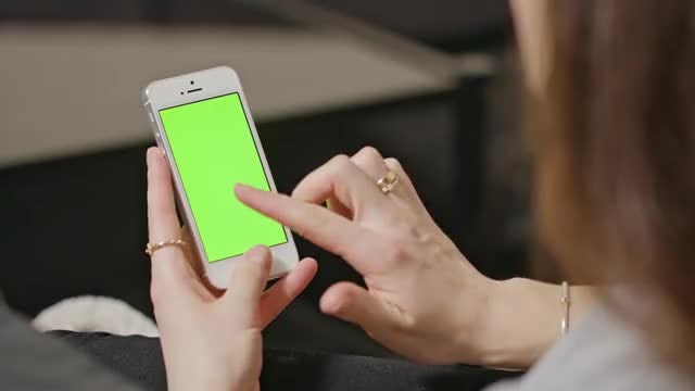 Woman Tapping On Smartphone: Stock Video