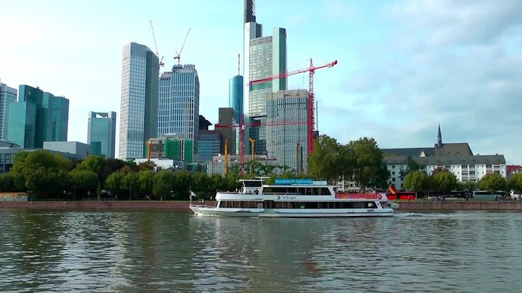 Towers And Ferryboat Near River In Frankfurt: Stock Video