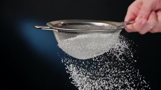 Female Hand Sifting Flour: Stock Video