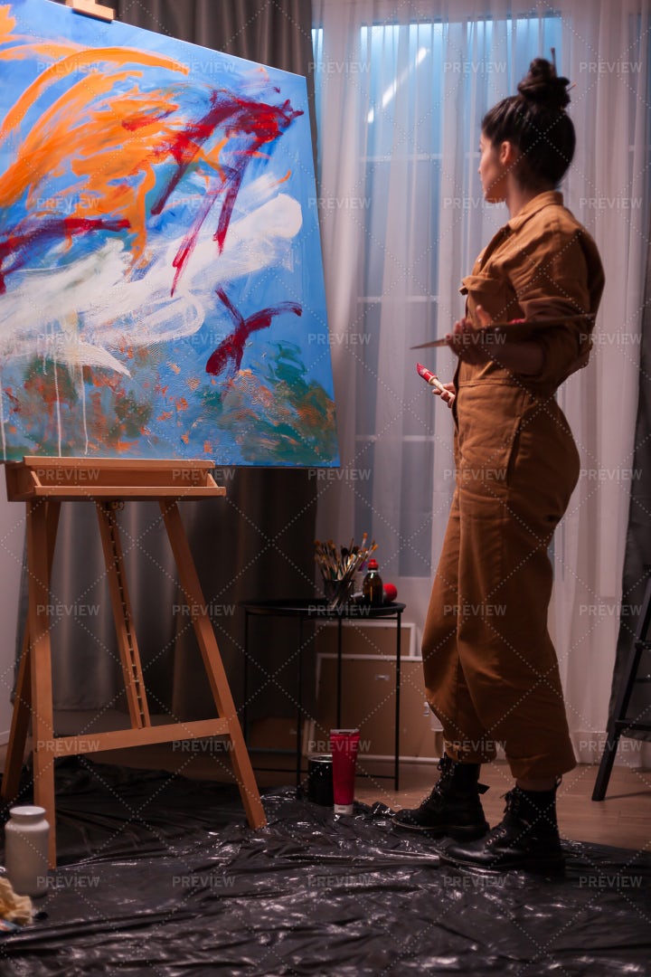 Woman Admiring Painting: Stock Photos