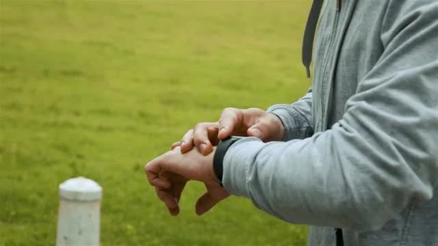 Sports Man Checks Smart Watch: Stock Video