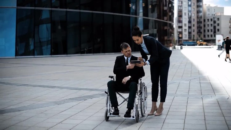 Boss In Wheelchair His Employee With Tablet: Stock Video