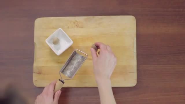 Top View of Grating Nutmeg: Stock Video