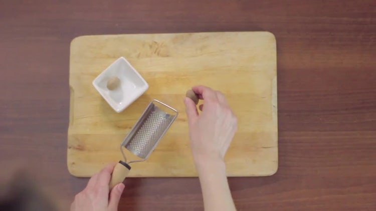 Top View of Grating Nutmeg: Stock Video