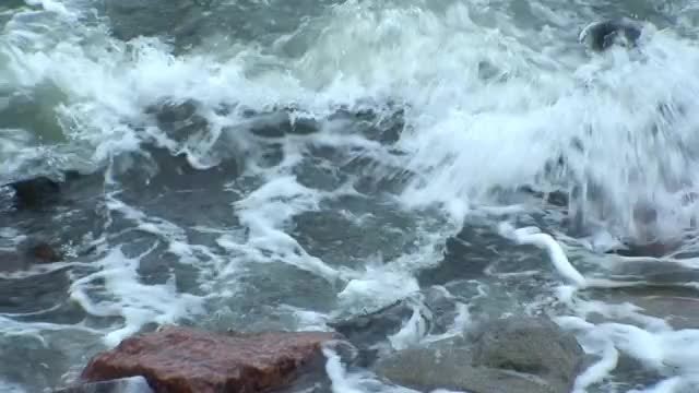 Waves Crash Onto Shoreline: Stock Video